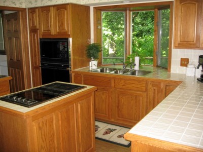 Kitchen View With Bay Windows Looking Out Over Garden
