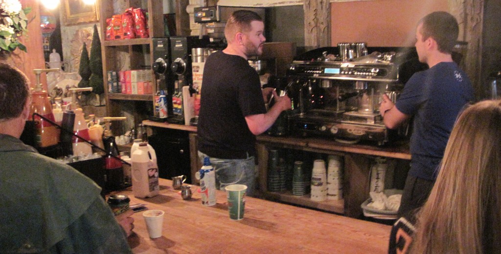 Employees at The Loft prepare espresso for a cappuccino
