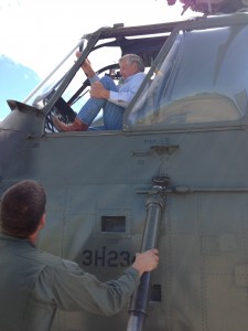 Jay Brickell climbing into a restored H-34 helicopter