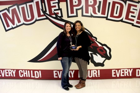High schooler Darian Sales [right], pictured next to counselor Tamara Day, displays her PlayStation Vita.