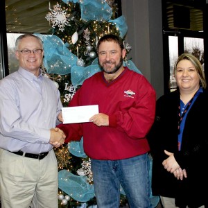 Pictured presenting the check to R-I Assistant Superintendent of Business Rod Priest [left] is Briggs Area Manager Brad Massey and Human Resources Manager Michelle Shelton. 