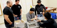 Briggs & Stratton engineers [from left] Jason Myers and Jonathan Eads take time out of their schedule to visit PBHS and consult with the Robotics Club as students Chang Chi, Diego Rivetti and Bryan Nguyen build their robot for the competition. 