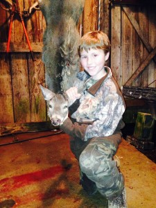 Jameson Gowan with his first deer, a Mississippi doe 