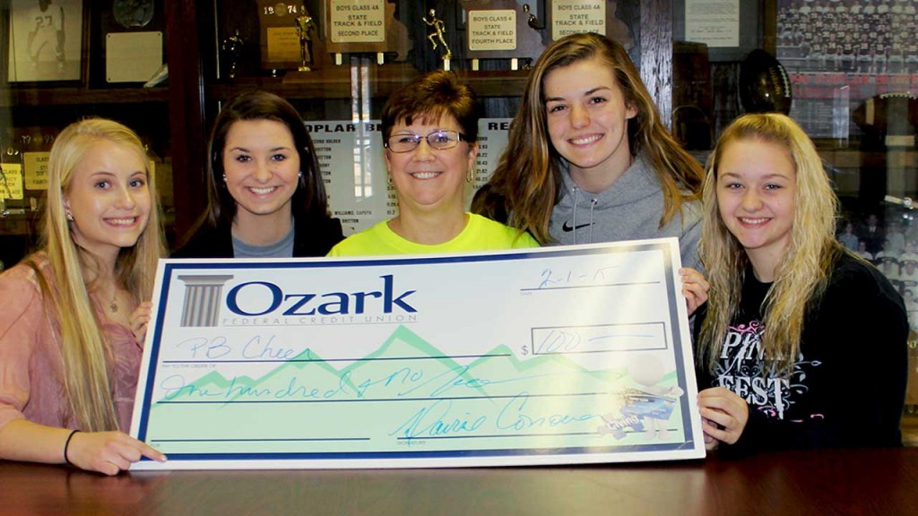 Pictured accepting the check from Business Development Specialist Davine Conover [center] of Ozark Federal Credit Union on Wednesday, Feb. 4, are PBHS senior cheerleaders [from left] Jamie Hobbs, Mallory Dye, Leeza Edmundson and Rachael Taylor.