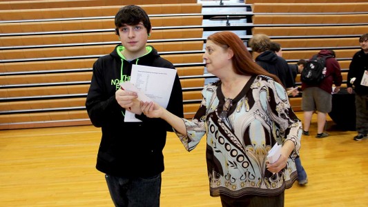 As one of three ‘fickle finger of fate’ volunteers, KWOC’s Brittney McKay delivers senior Brannon Anthony an unexpected bill that students were supposed to prepare for under their ‘emergencies savings and spending plan.’ A few lucky students received good news. 