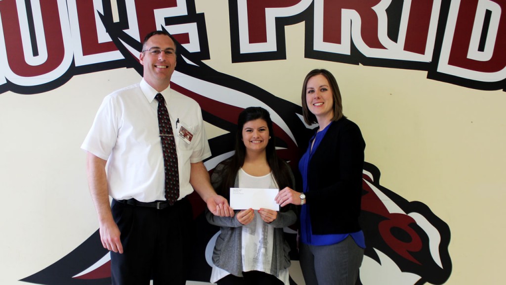 Pictured presenting the scholarship to student Lydia Keller on Wednesday, April 22, are PBHS Principal Mike Kiehne and Foundation Vice President Emily Hogg.
