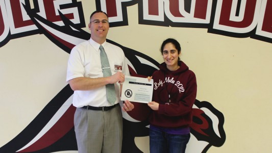 Namara Haq is presented the certificate honoring her as a top academic student of 2015 on Wednesday, April 8, is PBHS Principal Mike Kiehne. 