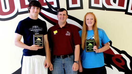 Pictured presenting the awards to the students on Friday, May 1, is Booster Club member Brian Taylor.