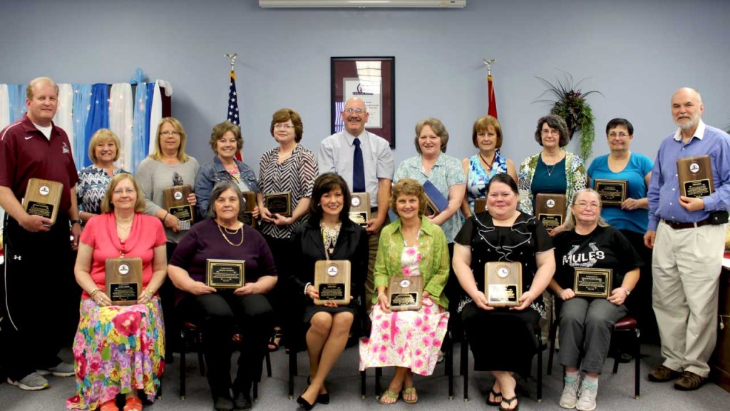 (Back row from left) Stan Bullington, Sharon Brandt, Lori Tapp, Kim Lawson, Debbie Hellums, Charlie Brown, Cindy Chronister, Jerris Evans, Sue Cooper, Sharon Domyan and Gary Garner; (front row from left) Jo Nell Seifert, Georgia Stephens, Debbie Holt, Terena Whitworth, Joy Burke and Maxine Denney. Not present for the photo were Steven Briscoe, Barbara Brown, Vic Clark, Nancy Gray and Patty Reed.