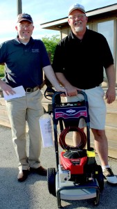 R-I Superintendent Chris Hon presents drawing winner Matt Funke with a Briggs & Stratton pressure washer.