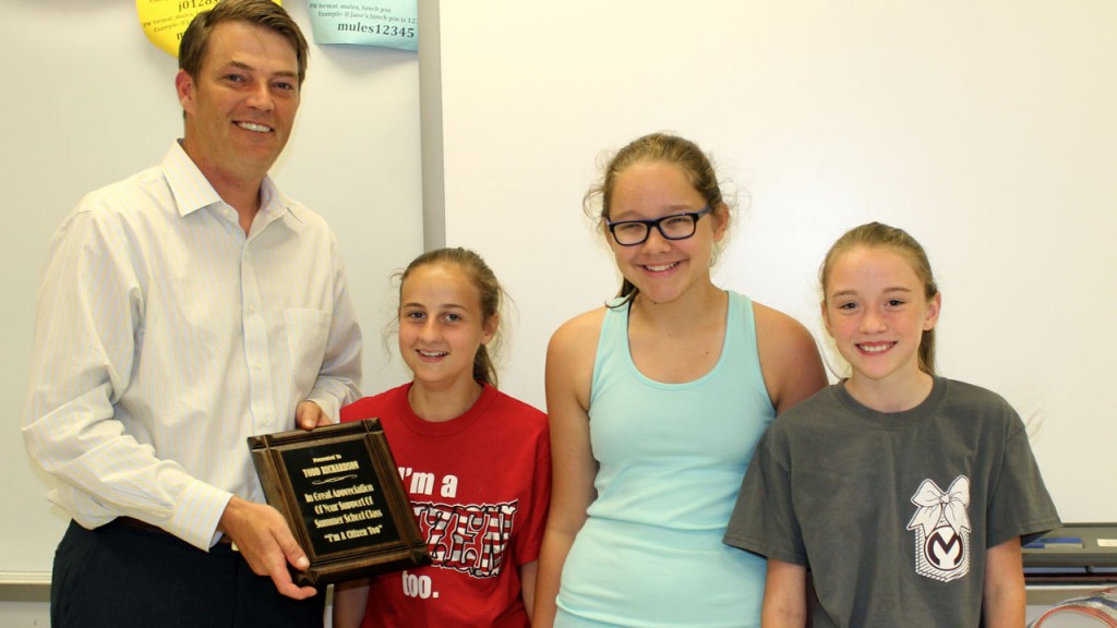 Students (from left) Katie Rose Pattillo, Audrey Cisne and McKenzie Knapp present Rep. Todd Richardson a plaque for his continued dedication to the “I’m a Citizen, Too” class.