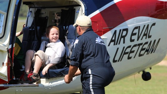 First Responders Club member Matthew Laster of the second grade gets to take a seat in a helicopter flown in by the Air Evac Lifeteam.